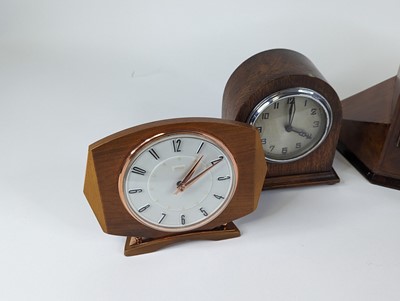 Lot 100 - An Art Deco walnut cased mantel clock of...