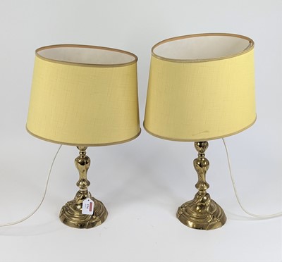 Lot 136 - A pair of Rococo style brass table lamps,...