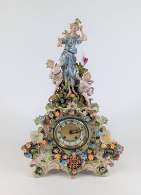 Lot 149 - A continental pottery floral encrusted figural...