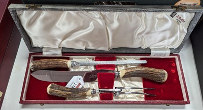 Lot 275 - A 20th century three-piece carving set, with...