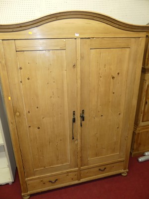 Lot 1153 - A French pine double door armoire having...