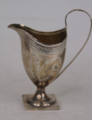 Lot 305 - A 19th century white metal cream jug, of...