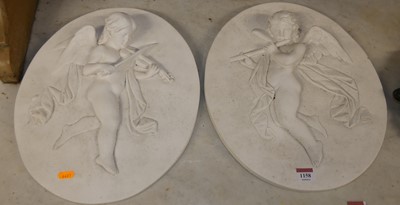 Lot 1158 - A pair of contemporary plaster oval wall...