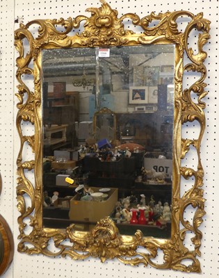 Lot 1166 - A pierced floral giltwood framed rectangular...