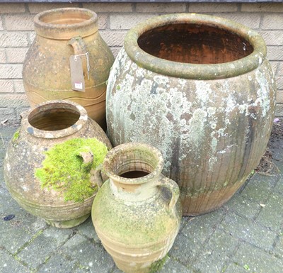 Lot 1176 - Four various terracotta planters, the largest...