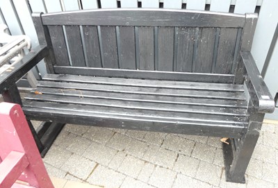 Lot 1178 - A black painted slatted wood three-seater...