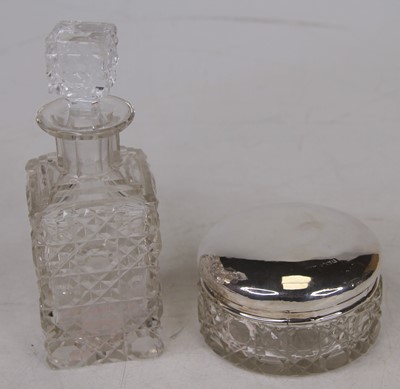 Lot 318 - A cut glass dressing table jar with silver lid,...