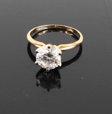 Lot 333 - A modern 14ct gold and cz set solitaire ring,...