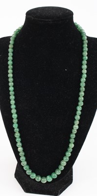 Lot 340 - A beaded nephrite necklace, 58cm; together...