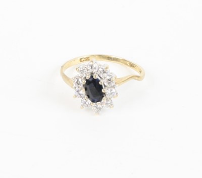 Lot 377 - A modern 9ct gold, blue and white sapphire set...