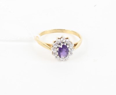 Lot 379 - A 9ct gold, amethyst and white sapphire set...