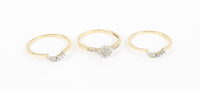 Lot 384 - A matching set of three 9ct gold and diamond...