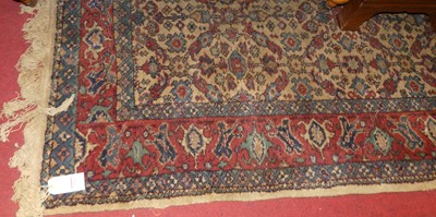 Lot 1204 - A Persian woollen cream ground Tabriz rug, 244...