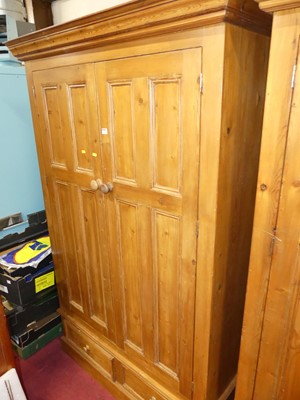 Lot 1223 - A contemporary stained pine double door...