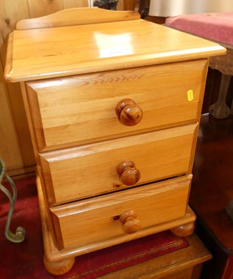 Lot 1234 - A pair of modern pine ledgeback three drawer...