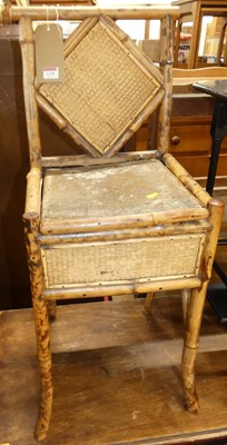 Lot 1238 - An early 20th century bamboo hinged box seat...