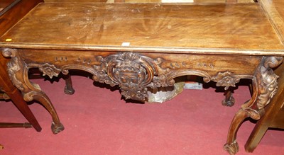 Lot 1240 - A floral carved hardwood console table, in the...