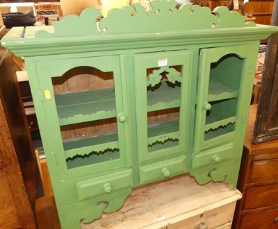 Lot 1245 - A rustic green painted hanging wall cupboard,...