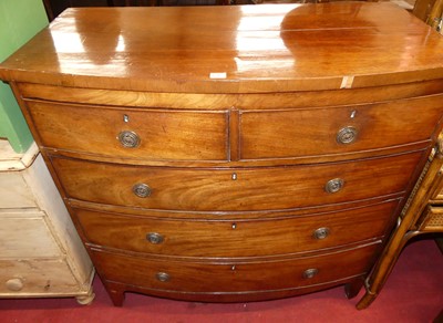 Lot 1248 - A Regency mahogany bow front chest of two...