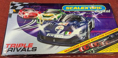 Lot 665 - A Scalextric Triple Rivals slot-racing set,...