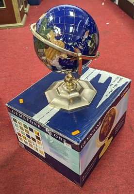 Lot 610 - A terrestrial globe, upon a brass stand, boxed,...