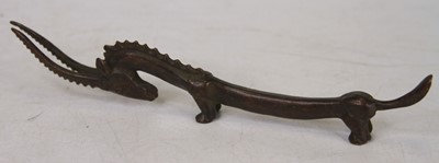 Lot 437 - A Chinese bronzed metal figure of an antelope,...