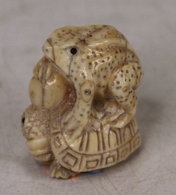 Lot 438 - A Japanese carved bone netsuke, in the form of...