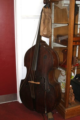 Lot 554 - A double bass with bow, h.195cm (a/f)