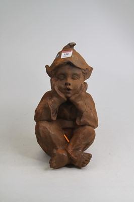 Lot 550 - A rusted metal model of a pixie, shown seated,...