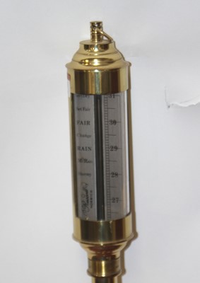 Lot 521 - A Russell brass nautical barometer, h.92cm