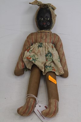 Lot 492 - An early 20th century doll, having a painted...