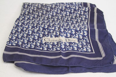 Lot 499 - A blue and white silk scarf with geometric...