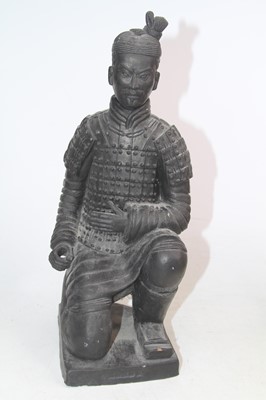 Lot 502 - A black painted terracotta figure of an archer,...