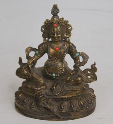 Lot 505 - A gilt metal figure of a deity, with inset...