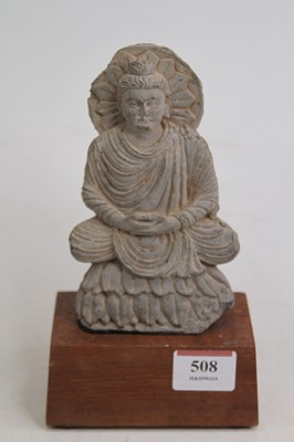 Lot 508 - A Tibetan figure of a seated deity, on a later...