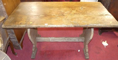 Lot 1322 - An oak trestle end dining table, length 136cm