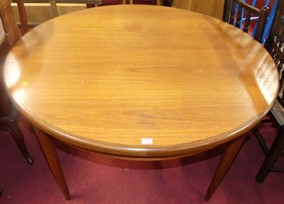 Lot 1330 - A 1960s G-Plan teak D-end extending dining...