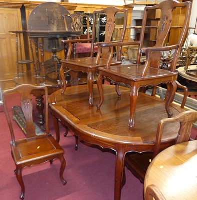 Lot 1332 - A contemporary Chinese hardwood dining suite,...