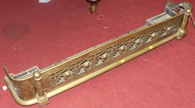 Lot 1334 - A late Victorian pierced brass curb fender,...