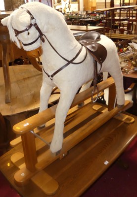 Lot 1341 - A plush upholstered child's rocking horse,...