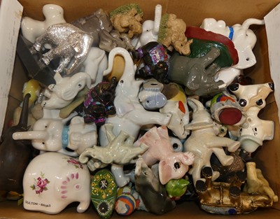 Lot 1436 - A collection of ceramic and wooden elephant...