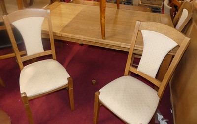 Lot 1351 - A contemporary joined blond oak dining suite,...