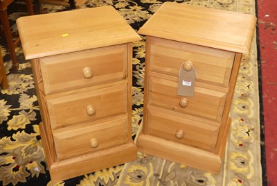 Lot 1386 - A pair of contemporary pine three drawer...