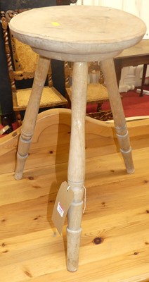 Lot 1393 - A beech three-legged milking stool, h.54cm