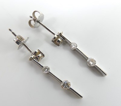 Lot 2744 - A pair of 18ct white gold diamond bar drop...