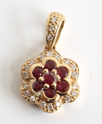 Lot 2697 - A yellow metal, ruby and diamond flower...