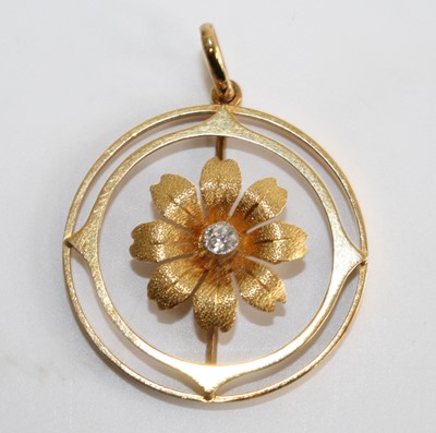 Lot 2700 - A yellow metal circular openwork floral...