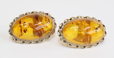 Lot 2704 - A pair of 9ct yellow gold amber stud earrings,...