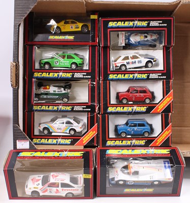 Lot 1833 - A collection of ten various boxed Scalextric...