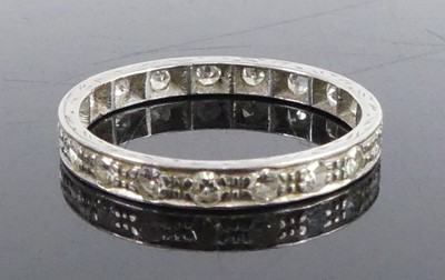 Lot 2736 - A white metal diamond full hoop eternity ring,...